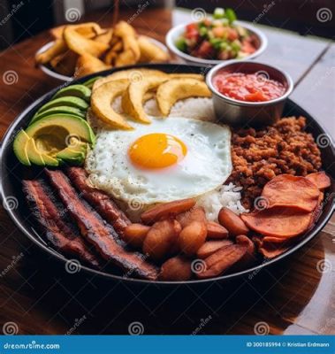  Bandeja Paisa! Un festin de saveurs colombiennes, mêlant des viandes savoureuses à une explosion de légumes frais!